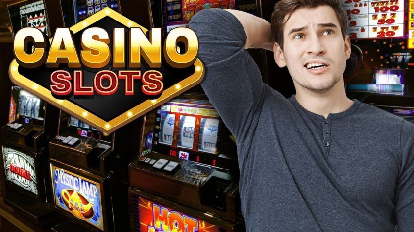 Man Next to Slot Machine